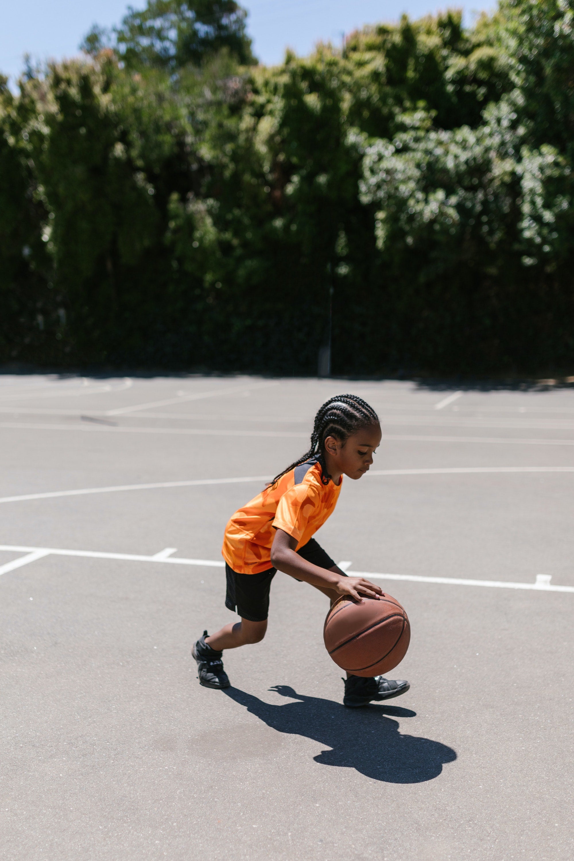 Child dribbling a basketball