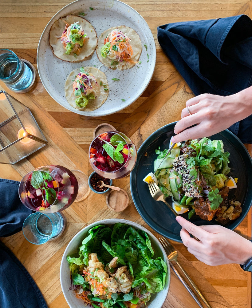 A person eating from a spread of prebiotic filled meals